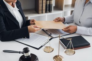 Client is submitting information on the paper of the prosecution document to the lawyer.